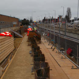Sheet piled retaining wall